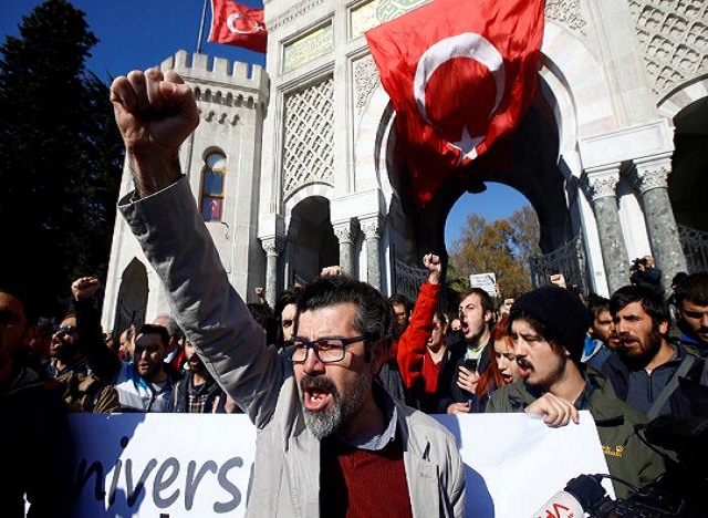 Demonstrators shout slogans during a protest against a purge of thousands of education staff since an attempted coup in July, in front of the main campus of Istanbul University at Beyazit square in Istanbul